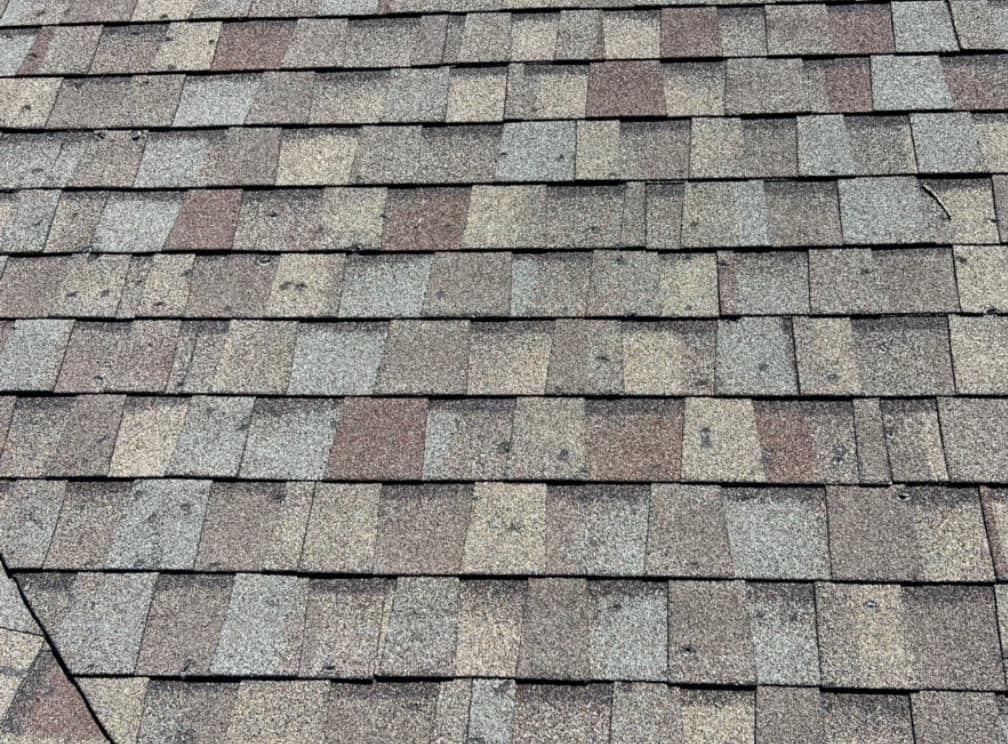 Hail damage across an asphalt shingle roof